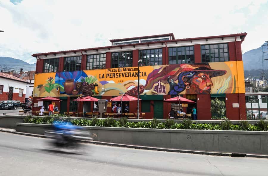Bogota Food Tour with over 12 Tastings & Tejo - Ajiaco, fruit finds, and lechona: the first big payoff